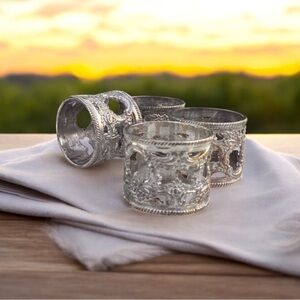 Silver plated ornate napkin rings set of 4